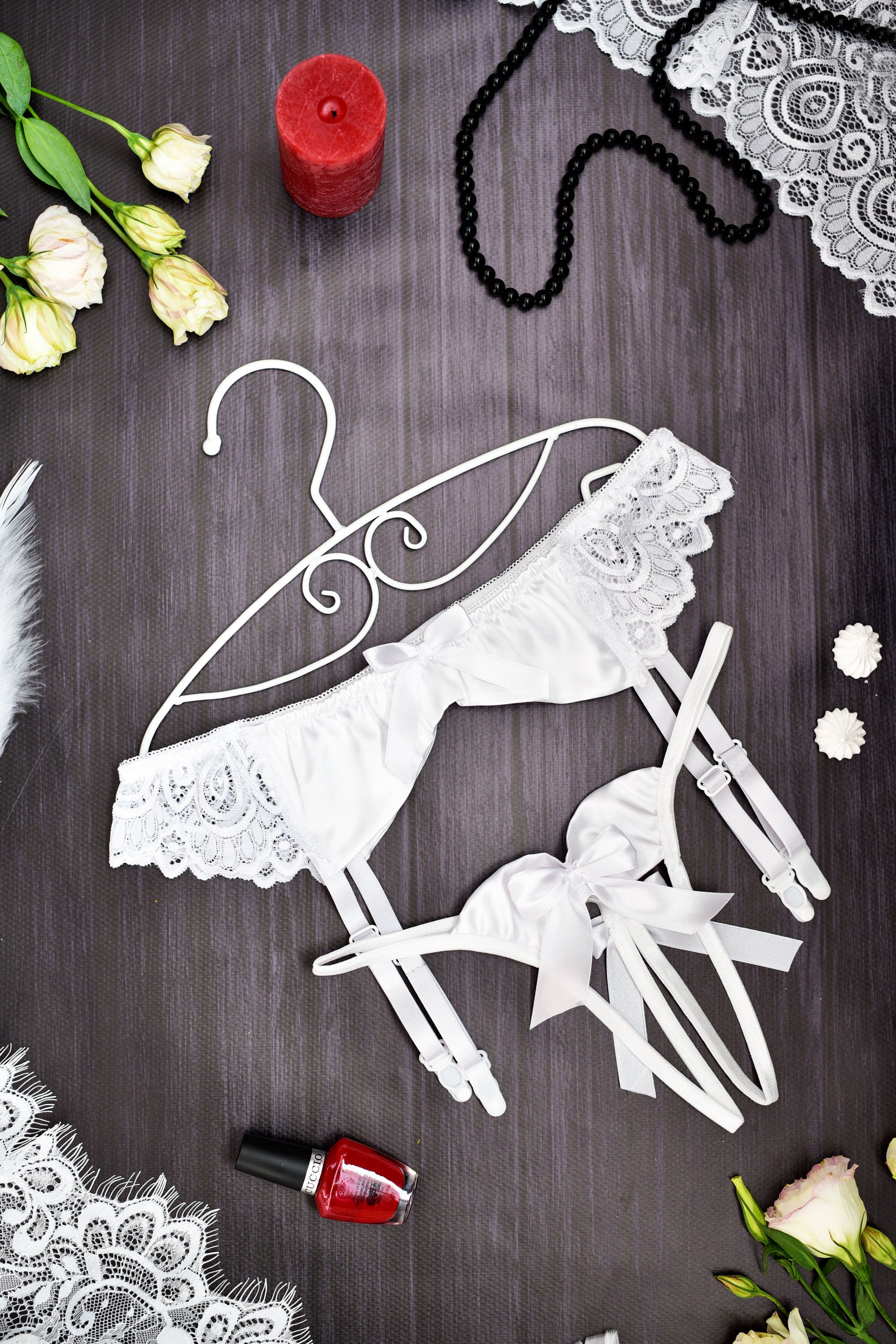 White lace lingerie set with a matching garter belt and bow