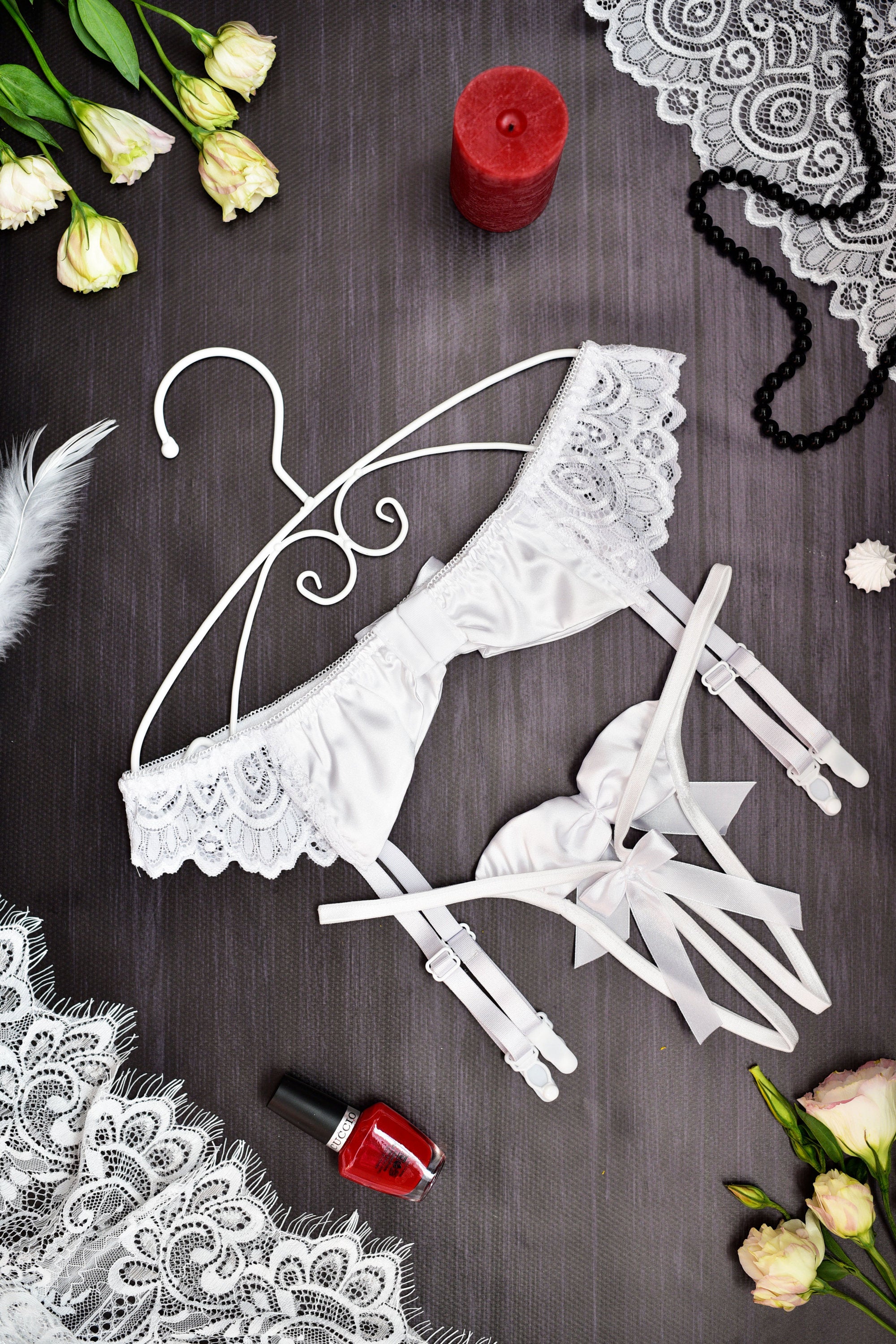 White lace and satin garter belt set with attached suspender straps