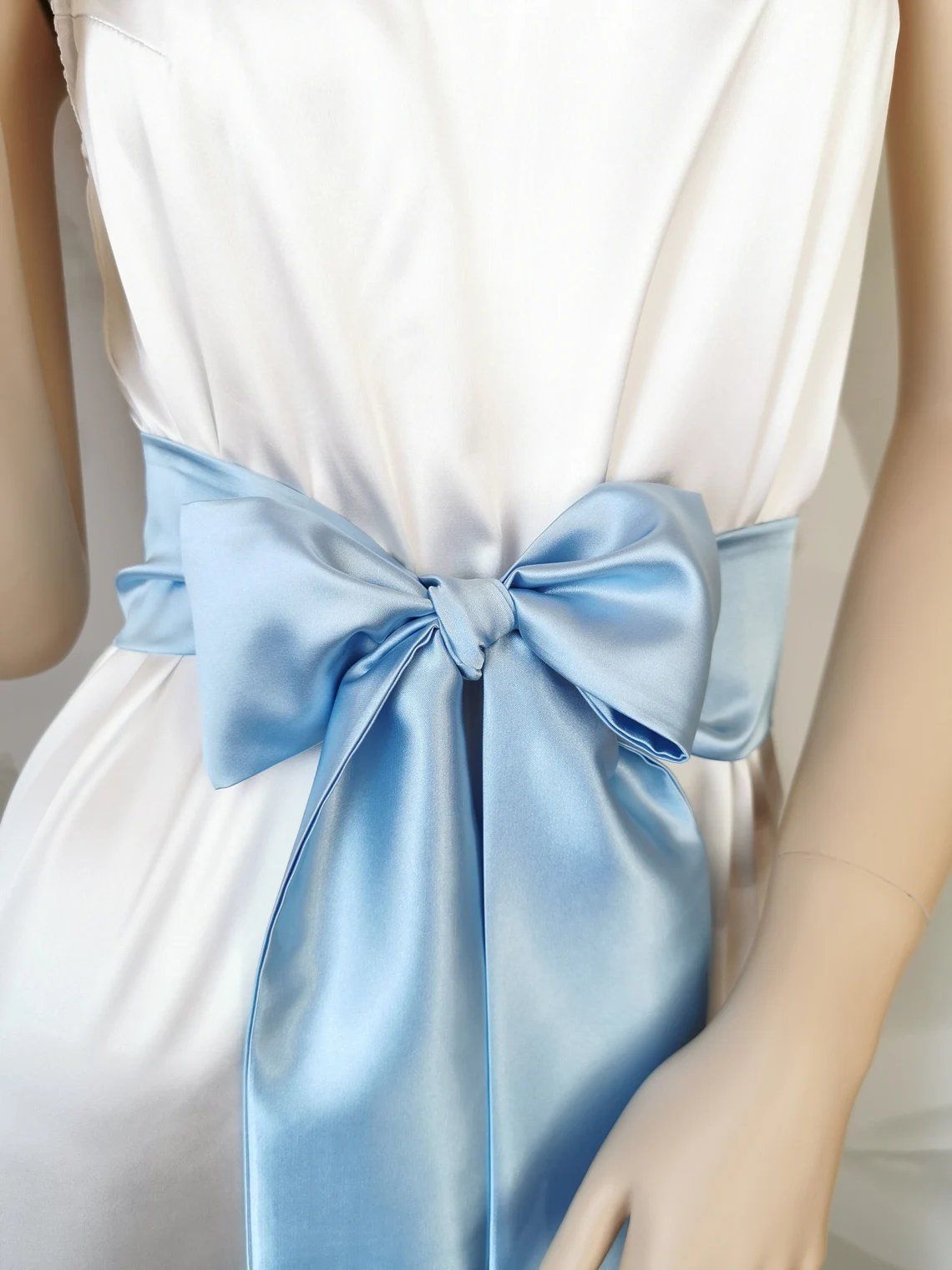 Light blue satin waist belt with flowing bow tails