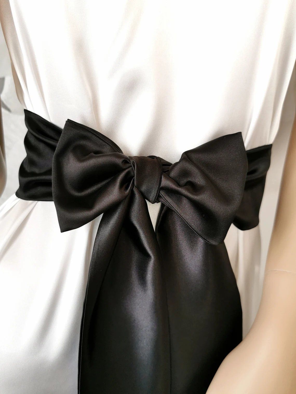 Classic black satin waist belt with flowing bow tails