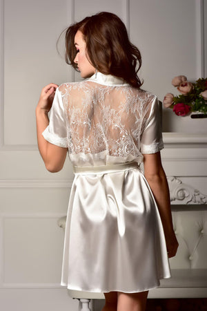 Woman wearing a ivory lace back satin robe
