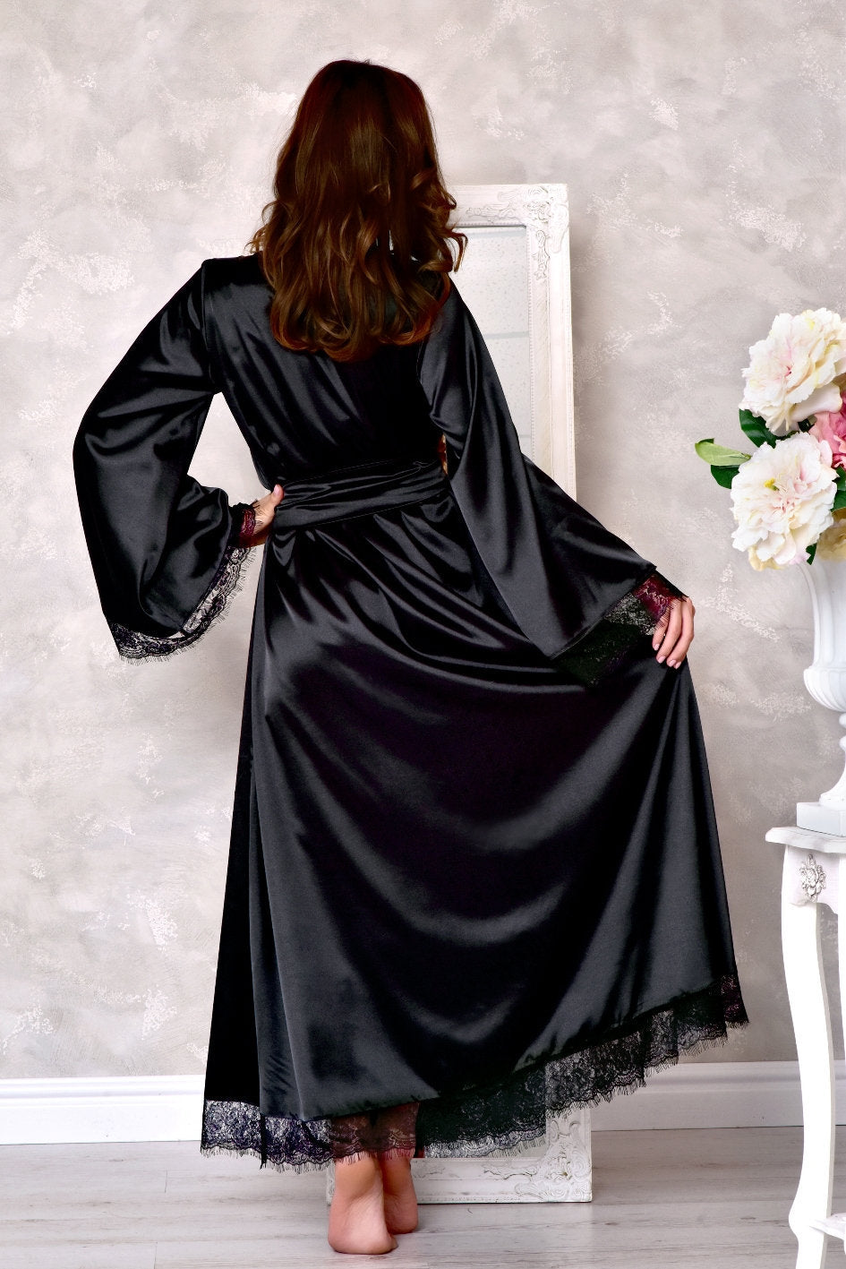 Floor-length black robe with kimono-style sleeves, ideal for a romantic photoshoot