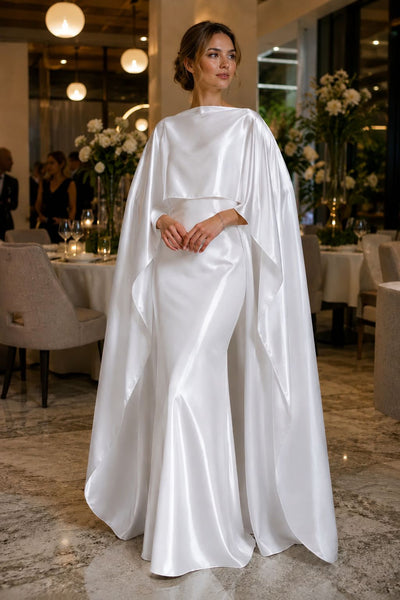 White satin bridal cape poncho over wedding dress