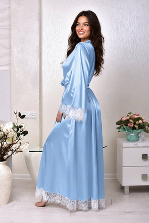 A woman wearing a light blue satin robe with white lace trim