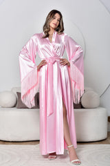 Woman wearing a pink satin robe