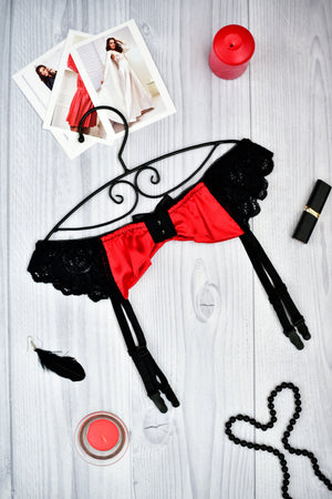 Red and black lace lingerie garter belt with a bow