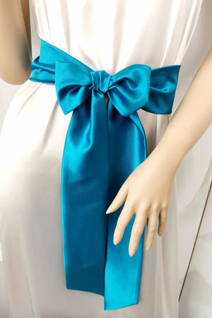 Aqua blue satin sash belt tied at the waist with a long bow