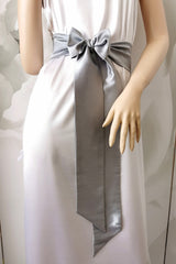 Gray satin sash belt tied at the waist with long tails
