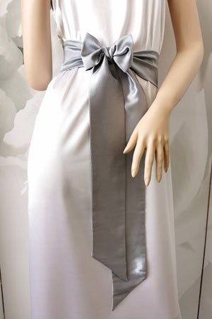 Gray satin sash belt tied at the waist with long tails