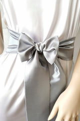 Gray satin bow belt with smooth shine and flowing ribbons