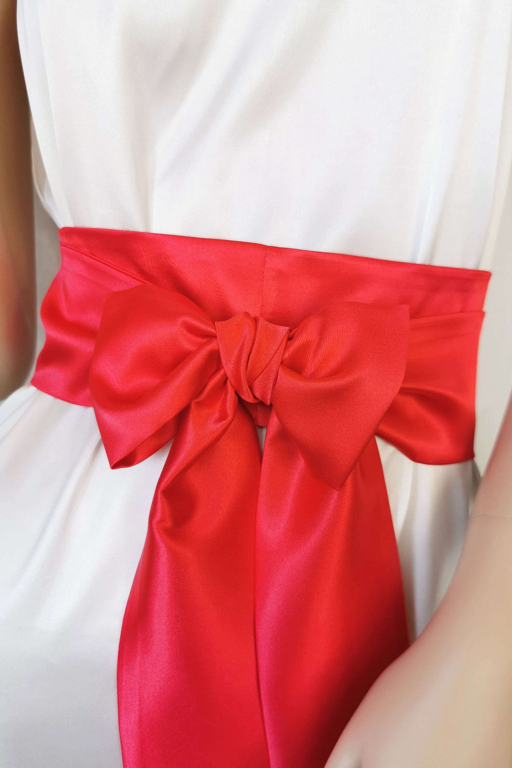 Bright red satin waist belt with long flowing tails