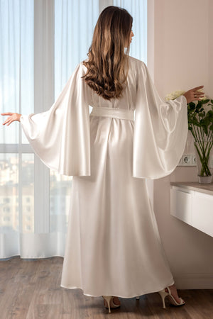 Elegant ivory robe for bride morning photoshoot